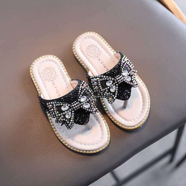 Naujas vaikiškų šlepečių modelis su kaspinu ir akmenukais