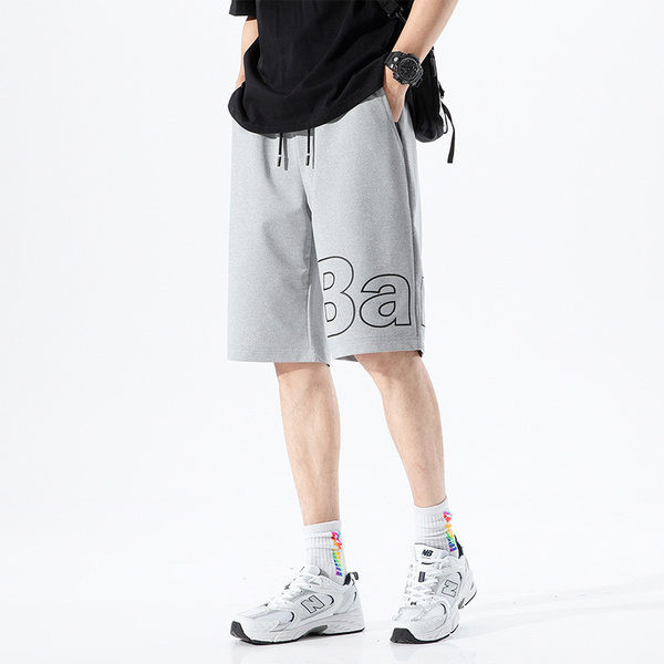 Térdig érő pamut rövidnadrág felirattal