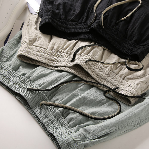 Férfi nadrág 3/4 hosszban és zsebekkel