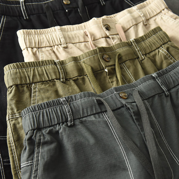 Uus mudel taskute ja lipsudega meeste lühikesed püksid