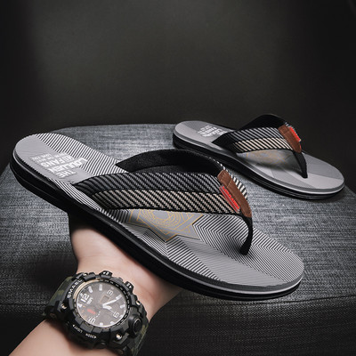 Summer men`s slippers between the toes