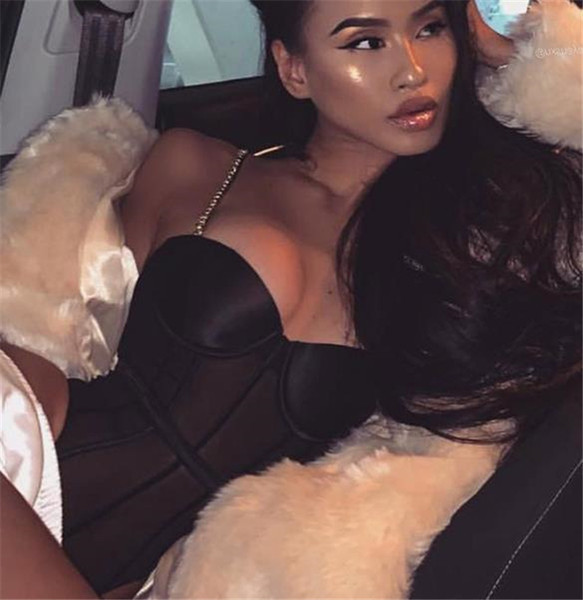 Sieviešu bodijs ar metāla lencēm un caurspīdīgu daļu