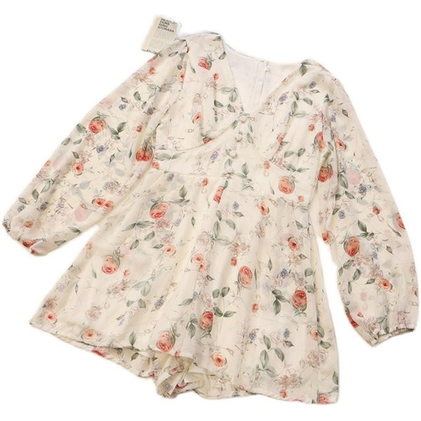 Sieviešu īss kombinezons ar garām piedurknēm un ziedu motīviem