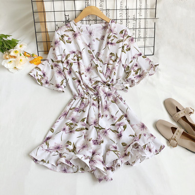 Moderns sieviešu kombinezons ar špica kakla izgriezumu un ziedu motīviem