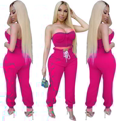 Naiste kaheosaline rinnakorv ja vöökohal lipsudega püksid