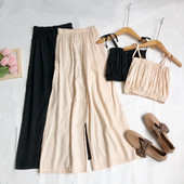 Sieviešu komplekts no divām daļām platām biksēm un topiņa ar plānām lencēm