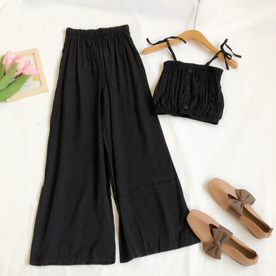 Sieviešu komplekts no divām daļām platām biksēm un topiņa ar plānām lencēm