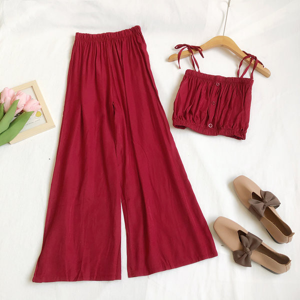 Sieviešu komplekts no divām daļām platām biksēm un topiņa ar plānām lencēm