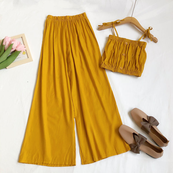 Sieviešu komplekts no divām daļām platām biksēm un topiņa ar plānām lencēm