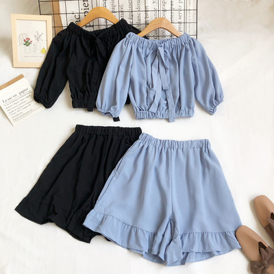 Uue mudeli naiste komplekt lühikese pluusi ja kõrge vöökohaga pükstega