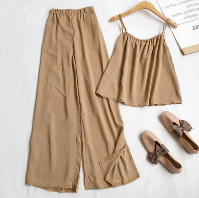 Sieviešu komplekts no divām daļām bikses un platām biksēm ar šķēlumiem kājās