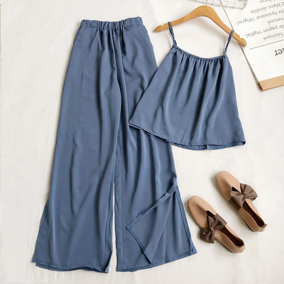 Sieviešu komplekts no divām daļām bikses un platām biksēm ar šķēlumiem kājās