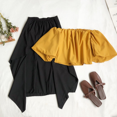 Sieviešu komplekts ar īsu blūzi un gariem svārkiem