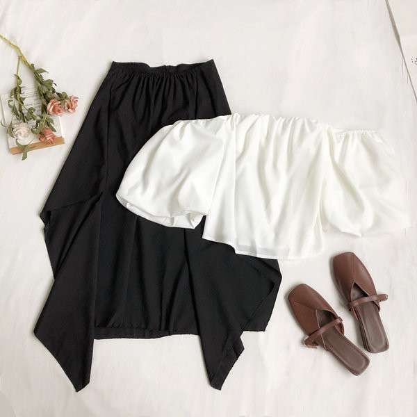 Sieviešu komplekts ar īsu blūzi un gariem svārkiem