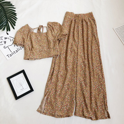 Naiste komplekt lühikese pluusi ja lillemotiividega pükstega