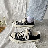 Tekstiilist valmistatud vabaaja tossud paelte ja lameda tallaga naistele