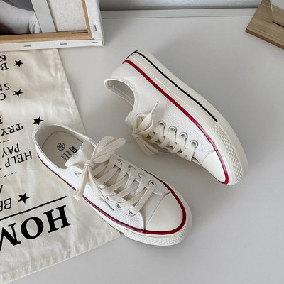 Tekstiilist valmistatud vabaaja tossud paelte ja lameda tallaga naistele