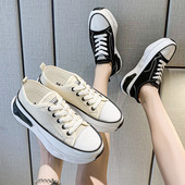 Naiste lõuendist tossud embleemi ja lameda tallaga