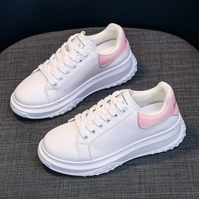 Naiste ümarad kõrge talla ja kirjaga tossud