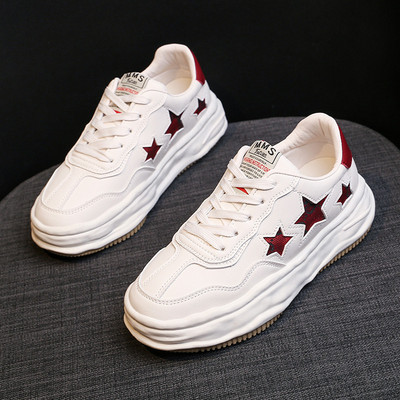 Naiste ökonahast tossud embleemi ja lipsudega