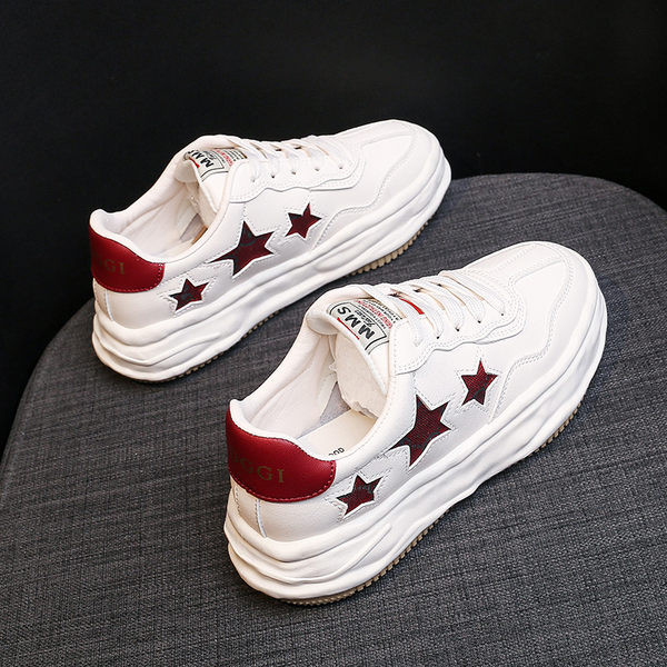 Naiste ökonahast tossud embleemi ja lipsudega