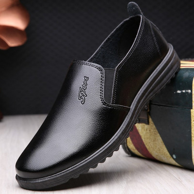 New model of men`s shoes made of eco leather with flat sole and inscription