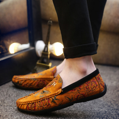 Stylish men`s moccasins with a pattern and a flat sole