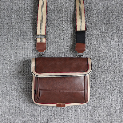 Férfi négyszögletes táska fém rögzítéssel és cipzárral