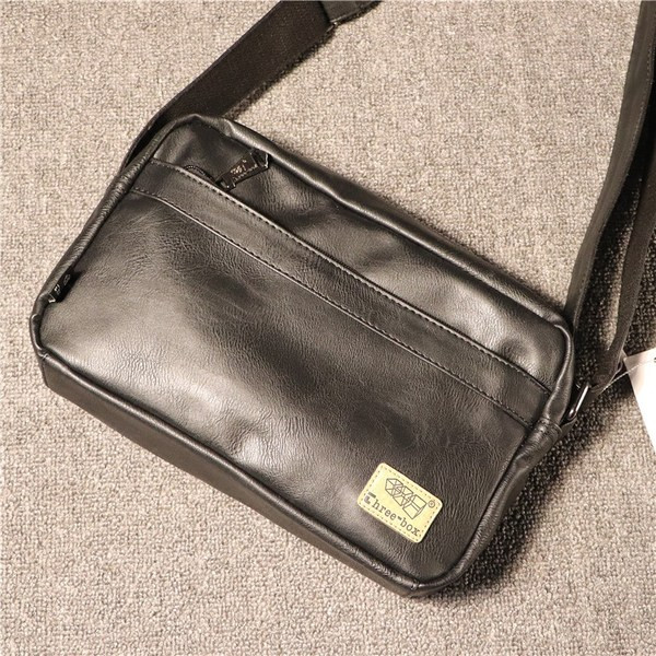 Vabaaja meeste nahast kott luku ja embleemiga