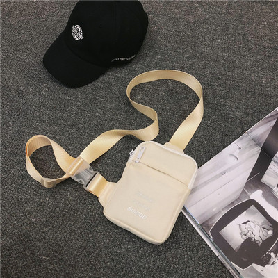 Väike tekstiilist õlakott, millel on kiri meestele