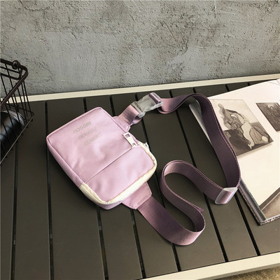 Väike tekstiilist õlakott, millel on kiri meestele