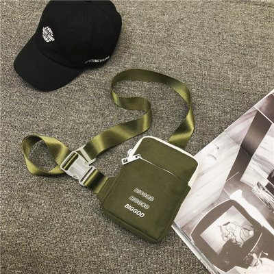 Väike tekstiilist õlakott, millel on kiri meestele