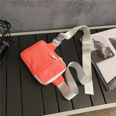 Väike tekstiilist õlakott, millel on kiri meestele