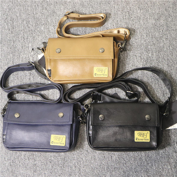 Uue mudeli kunstnahast embleemiga meestekott