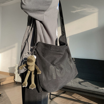 Ανδρική τσάντα καμβά με επιγραφή στον ώμο