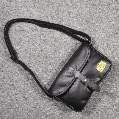 Uue mudeli nahast tõmbluku ja metallkinnitusega meestekott