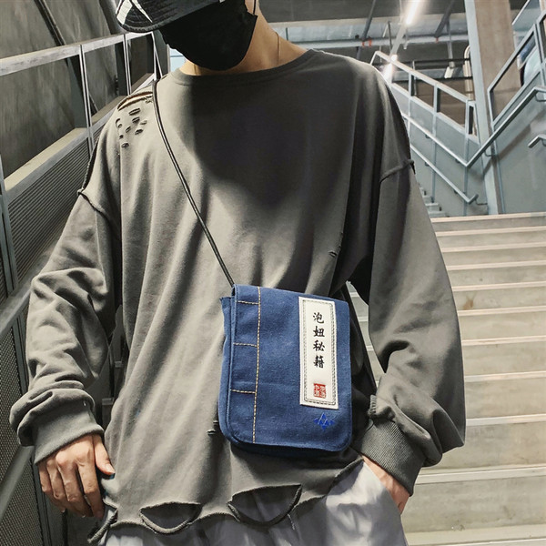 Meeste kandiline tekstiilist kott kirjaga