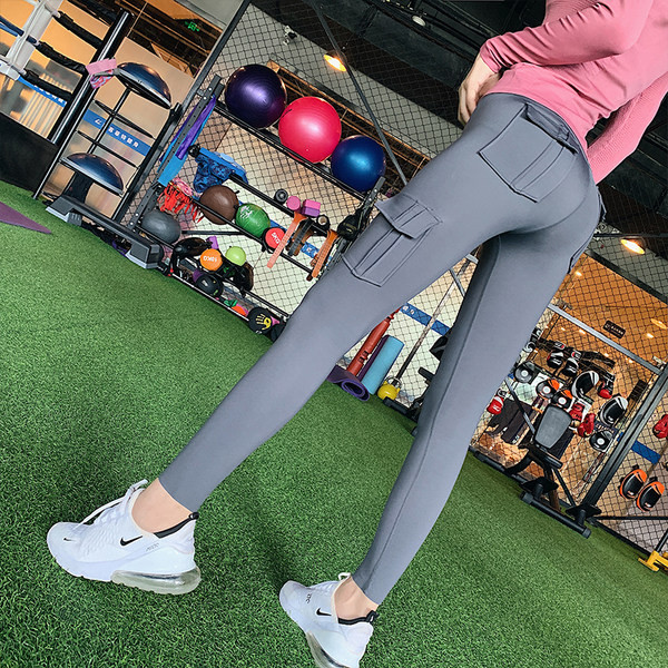 Naiste sportlikud retuusid taskute ja kõrge vöökohaga