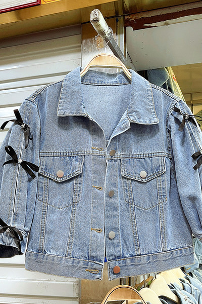 Új modell női farmerdzseki szalagokkal