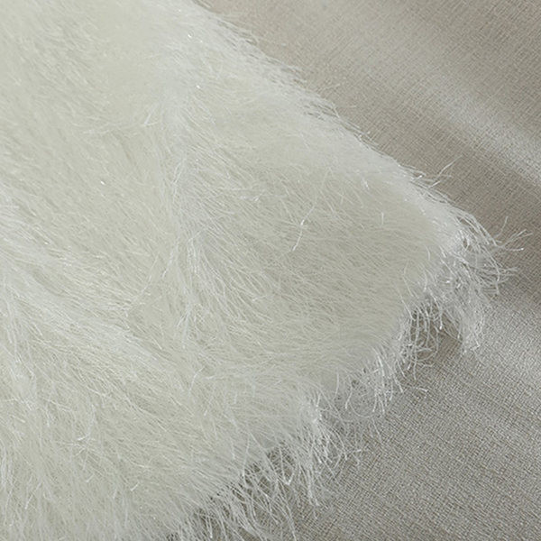 Aktuális női ruha bojttal és hosszú ujjal