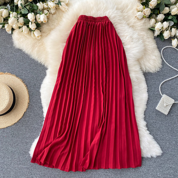 Hajtogatott női szoknya magas derékkal és szalaggal