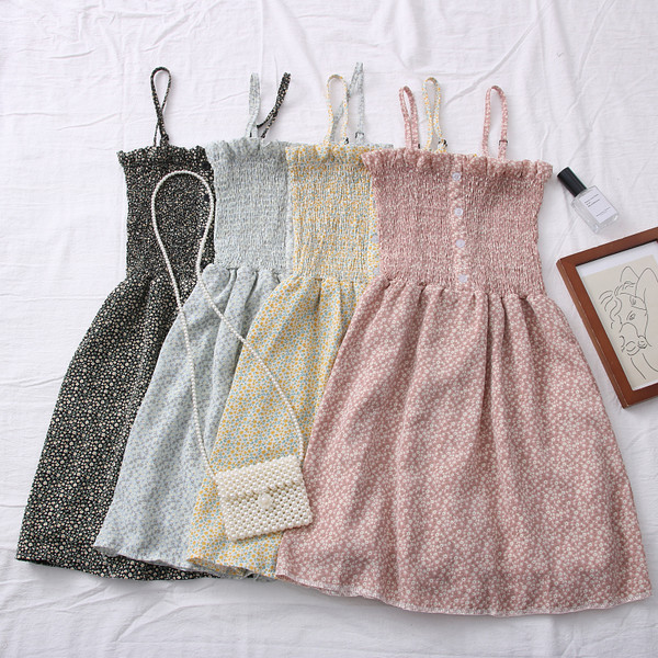 Uut mudelit peenikeste rihmade ja nööpidega naiste kleit