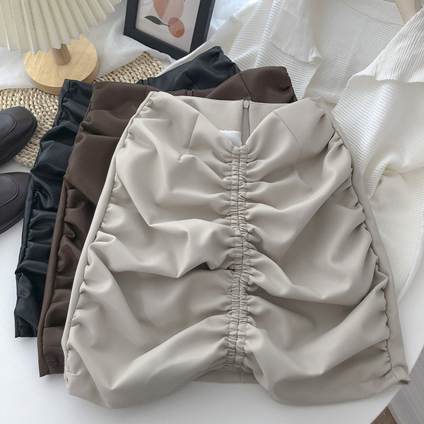 Ženska kožna suknja s patentnim zatvaračem i visokim strukom