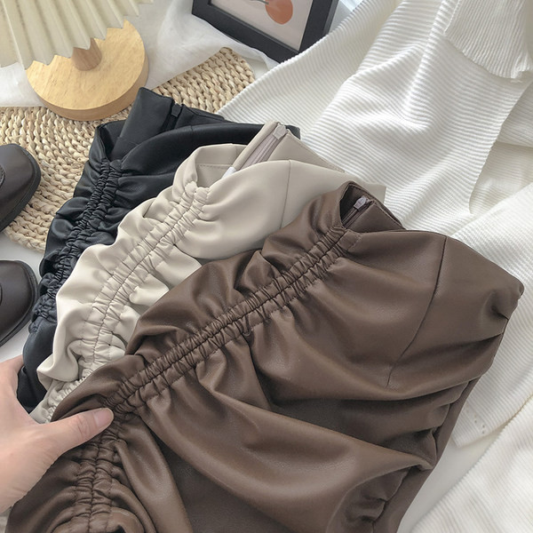 Ženska kožna suknja s patentnim zatvaračem i visokim strukom