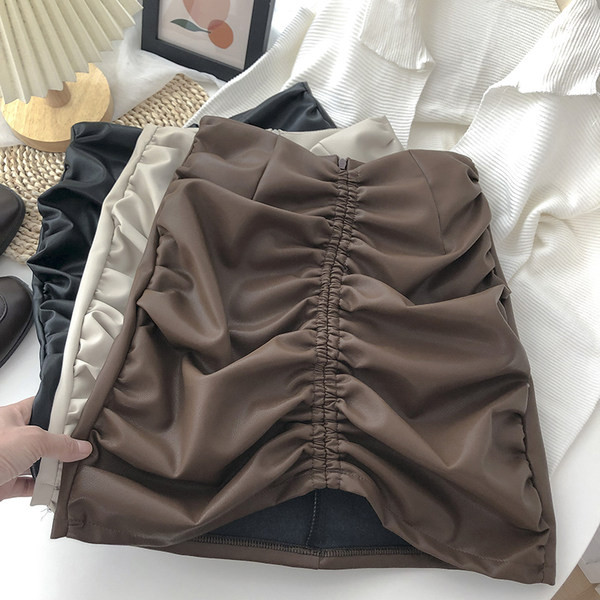 Ženska kožna suknja s patentnim zatvaračem i visokim strukom