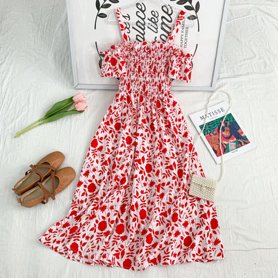 Új modell kivágott női ruha vékony pántokkal, virágmintával