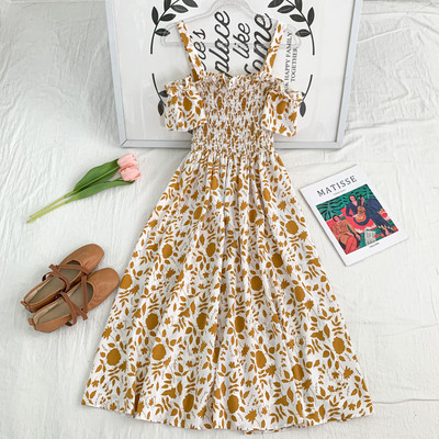 Új modell kivágott női ruha vékony pántokkal, virágmintával