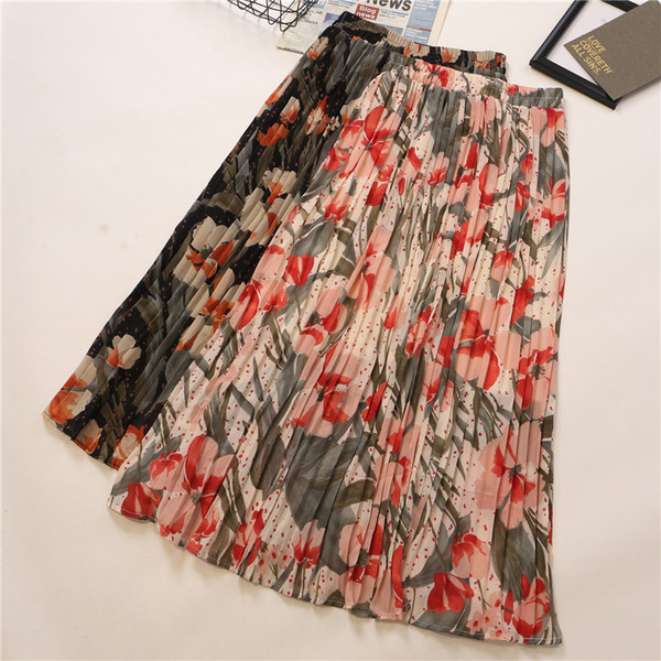 Plisirana ženska suknja sa cvjetnim uzorkom i visokim strukom