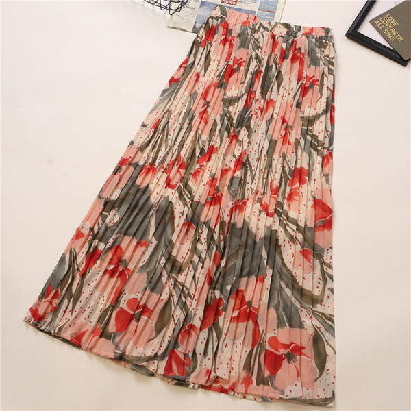 Plisirana ženska suknja sa cvjetnim uzorkom i visokim strukom