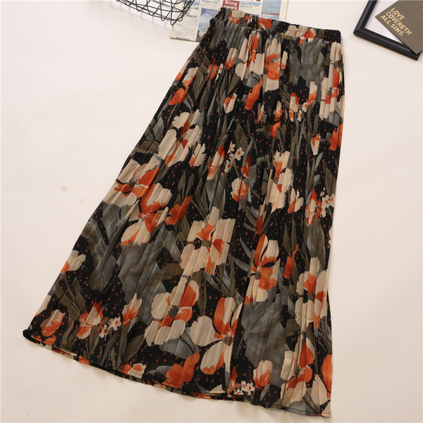 Plisirana ženska suknja sa cvjetnim uzorkom i visokim strukom